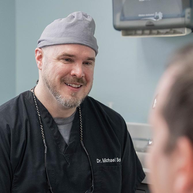 Dr. Michael Schut with a patient at Whiteville Family and Cosmetic Dentistry